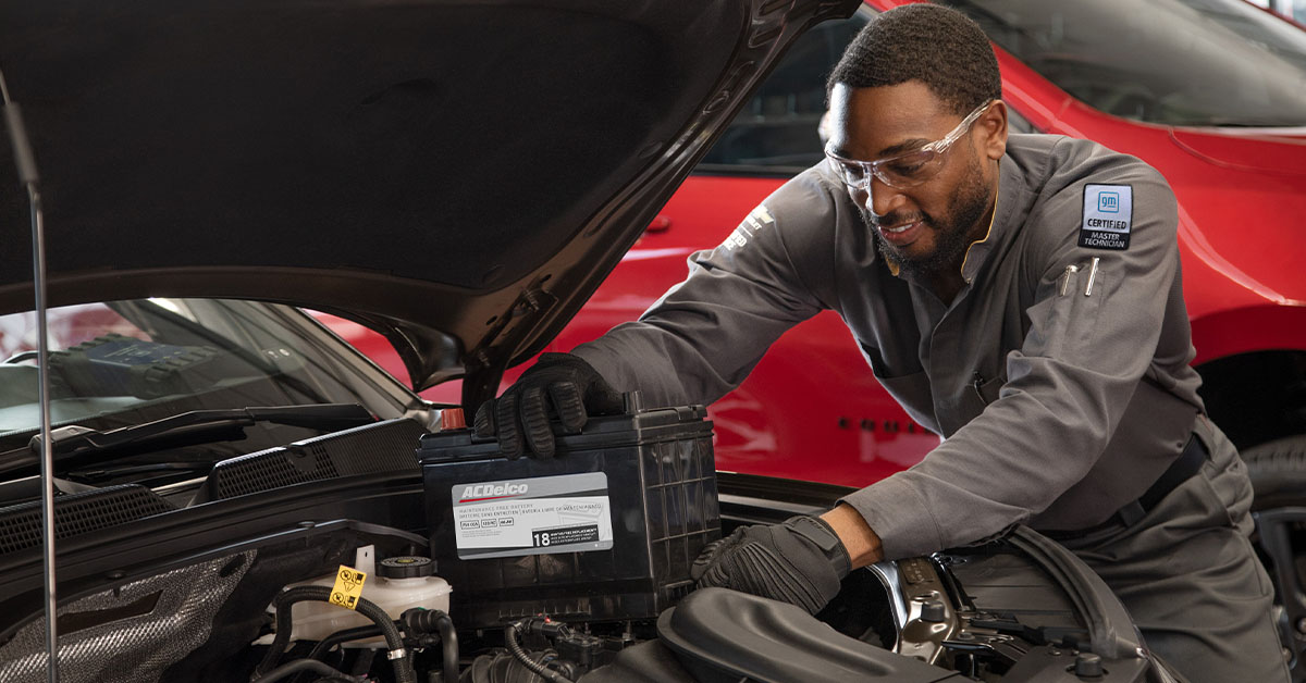 Service technician installing battery